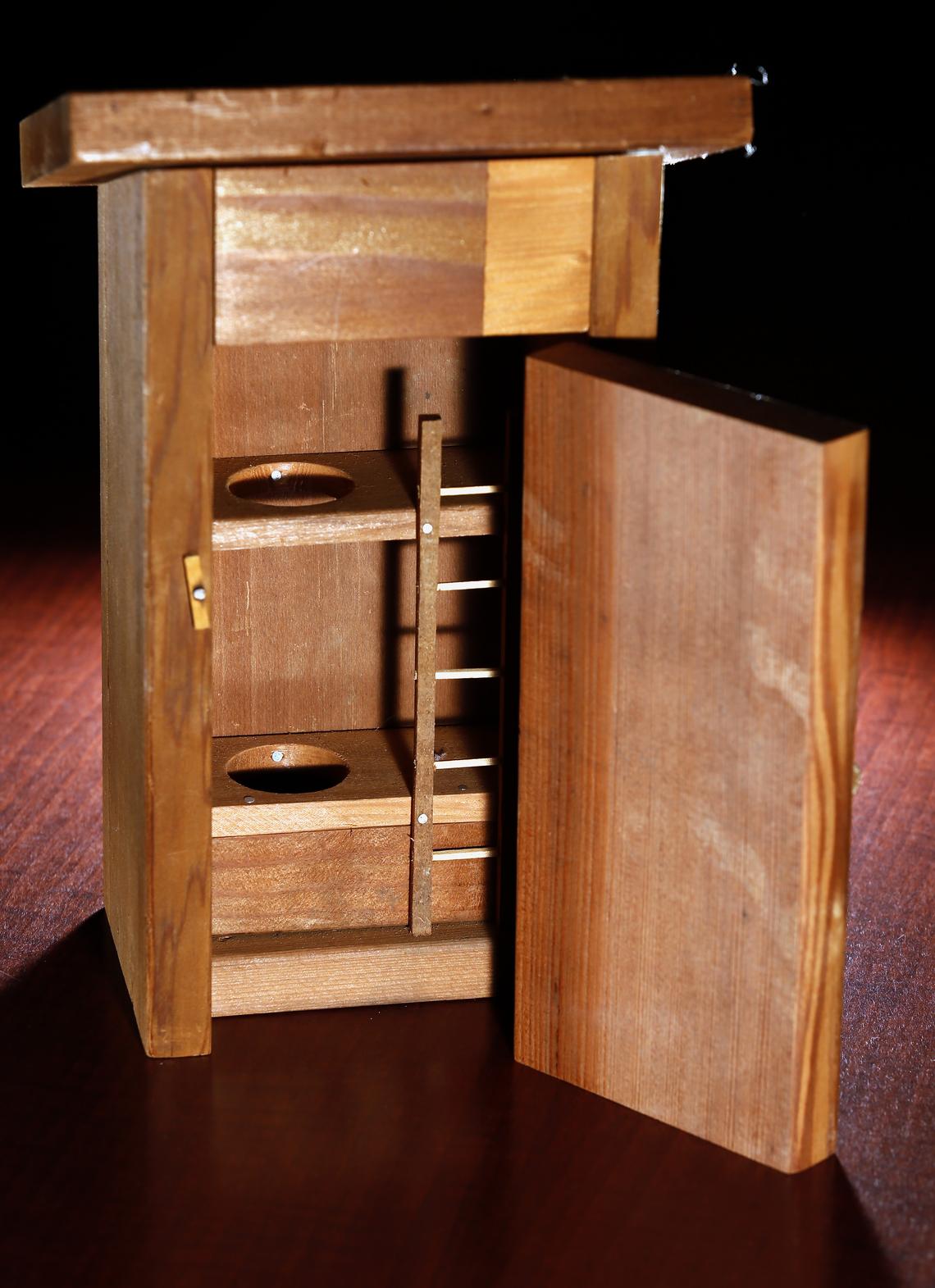 Darald Paulson put together this miniature outhouse and sent it to Bob Lind to view it. David Samson / The Forum