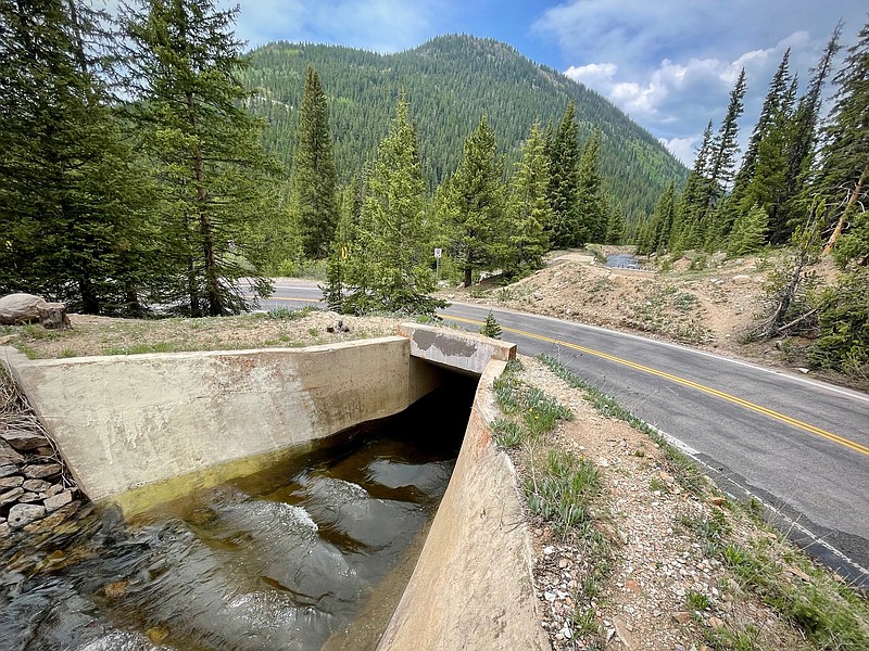 Water in Lost Man Canal runs under Highway 82 at Independence Pass in... Water in Lost Man Canal runs under Highway 82 at Independence Pass in...