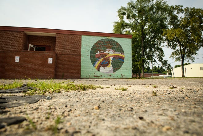 A faded mural on the side of TC Berrien Elementary School in Fayetteville on Friday, July 30, 2021.