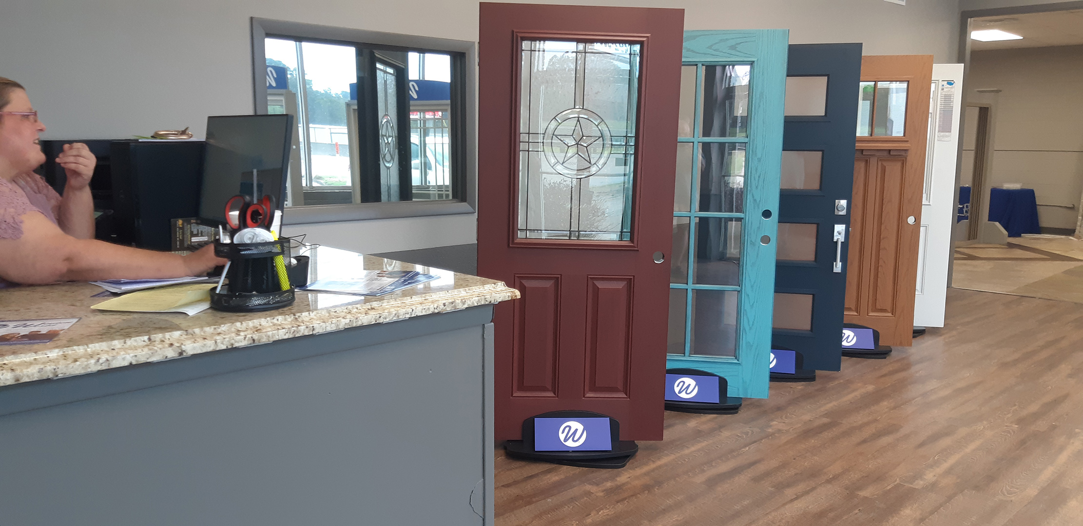 Brittnee Rogers manages the office and helps clients who come in to check out Window World in Nash, Texas. Window World opened in June and will open in September. story.lead_photo.caption