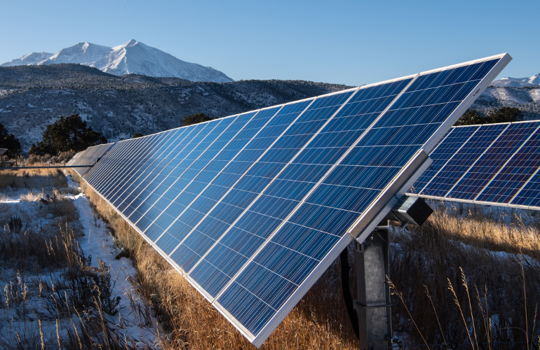 stock mountain solar nrel November 1, 2019- Mount Sopris is in the background of the Sunnyside Ranch Community Solar Array, a 1.8-megawatt project adjacent to the former Carbondale, CO landfill. The 6,107 panel,11 acres array is leased long-term to Clean Energy Collective with shares owned by residents. Holy Cross Energy is buying the electricity produced by the array and the array is an important part of the 43,000 member Energy Coop's distributed grid. (Photo by Dennis Schroeder / NREL)