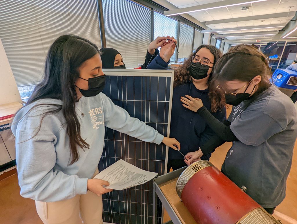 Infinitibcc Bergen STEM students working on a solar energy project.