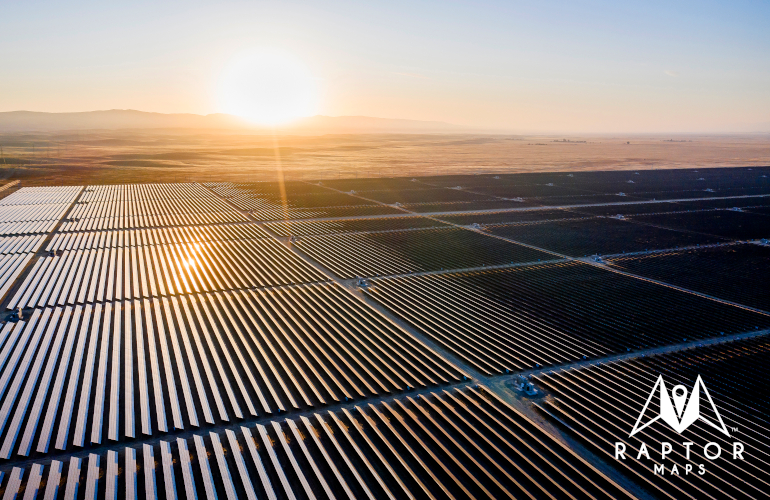 Sun rising over solar field, solar panels Raptor Maps solar PV aerial thermal inspections.